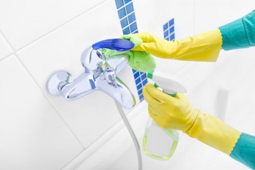 Cleaner maintaining a shared office kitchen in Pimlico